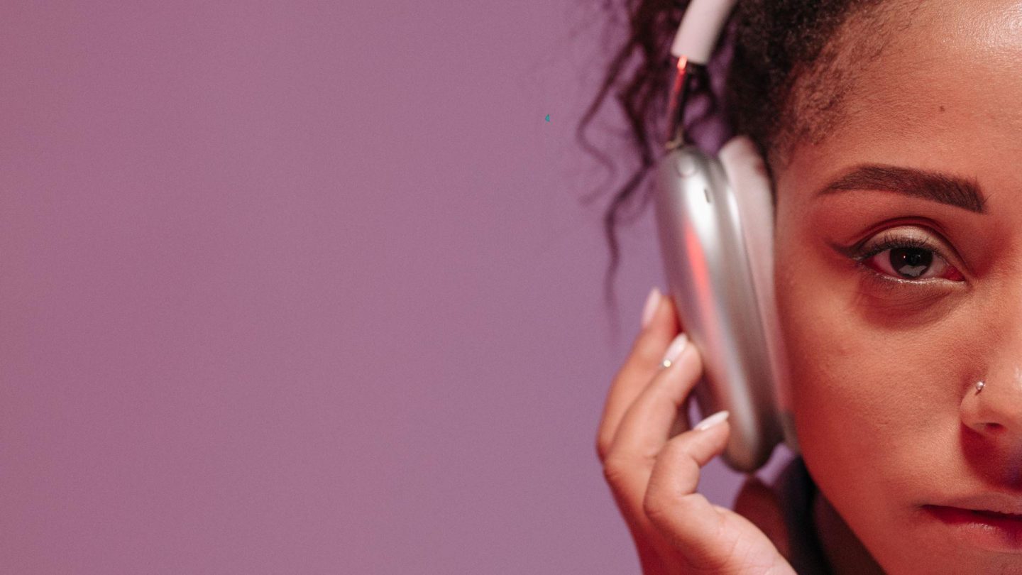 girl with curly hair wearing headphones