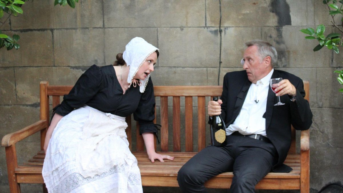 character in maid costume shouting at drinking character in suit