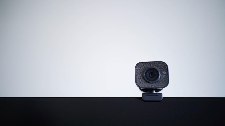 A web cam attached to the top of a computer screen