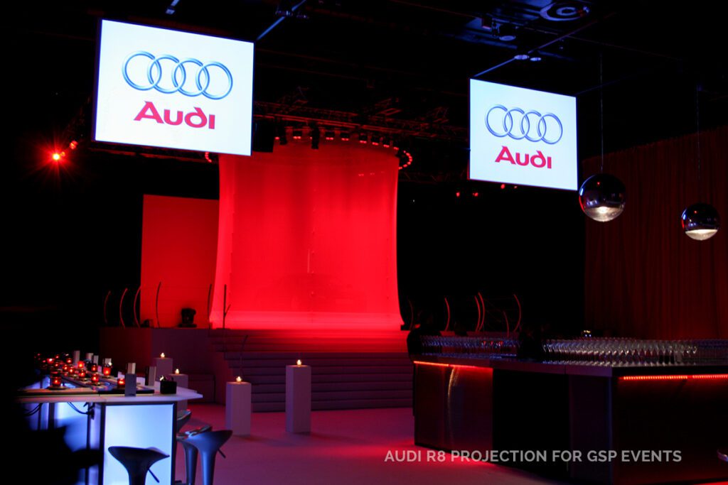 red lighting and screens at an Audi event